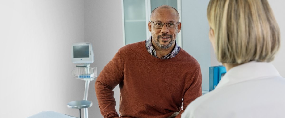 Image of a man talking to his doctor