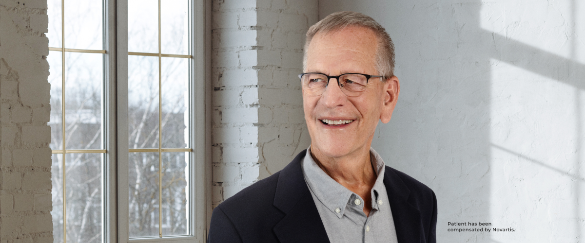 Bill stands confidently. He's ready to share his story.